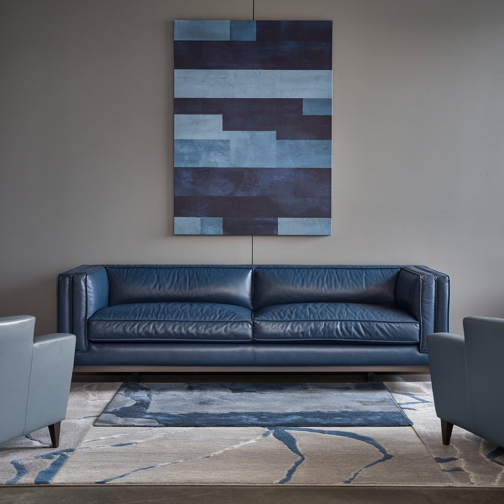 Sophisticated Blue Leather Sofa with Gray Accents